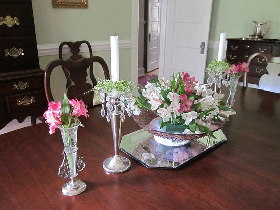 antique crystal vases and candlesticks with new springtime flowers